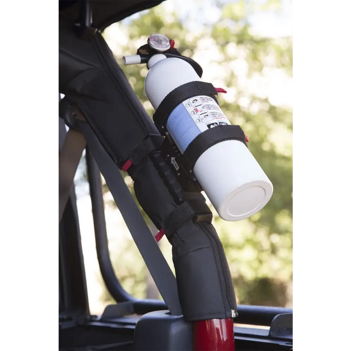 Rugged Ridge Jeep Wrangler Elite Fire Extinguisher Holder with bottle attached.
