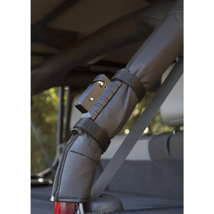 Rugged Ridge Jeep Wrangler fire extinguisher holder with seat belt