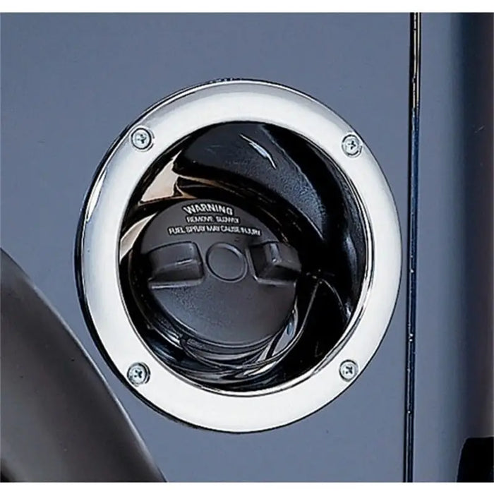 Close up of chrome gas tank filler bezel door handle
