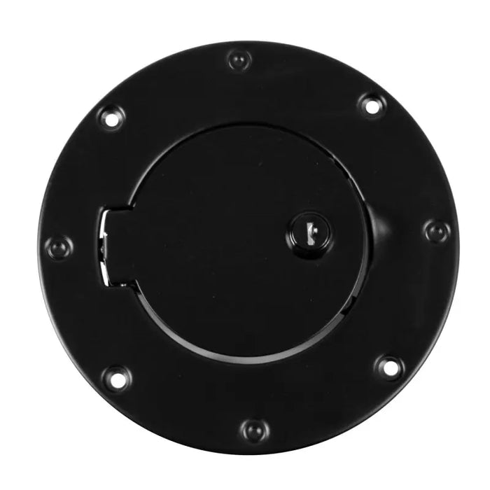 Black locking gas cap door with hole in the middle.
