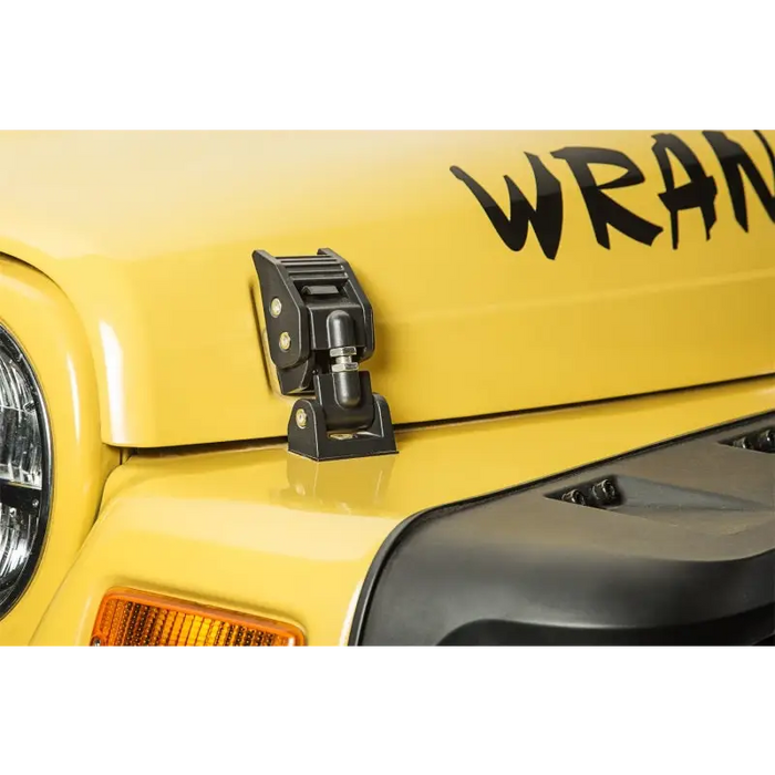 Yellow Jeep Wrangler TJ hood catches with black logo