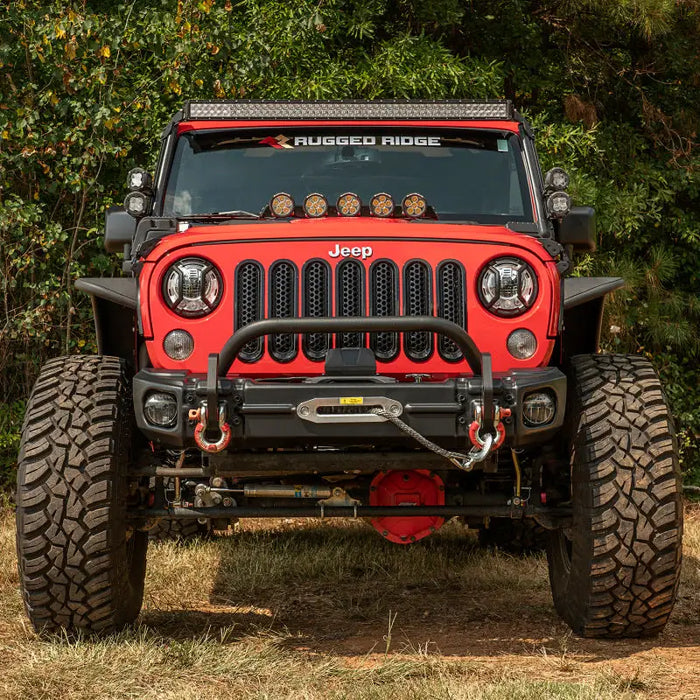 Rugged Ridge Arcus Front Bumper Set for 2018 Jeep Wrangler JK parked in field