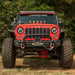 Rugged Ridge Arcus Front Bumper Tube Overrider Black JK parked in a field