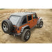 Rugged Ridge Bowless Soft Top Black Diamond 4-Door Jeep Wrangler JK parked on dirt