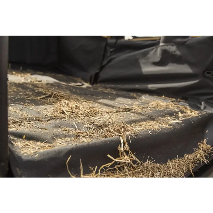 Rugged Ridge C3 Cargo Cover with black bag and straw bales.