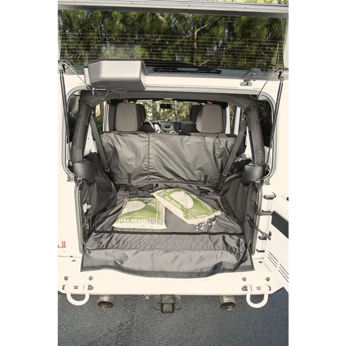 Rugged Ridge C3 Cargo Cover for Jeep Wrangler JKU - Rear view of white van with black trunk bag
