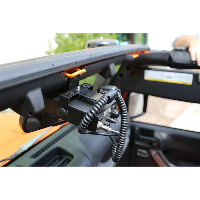 Rugged Ridge CB Radio Mount attached to dashboard in Jeep Wrangler JK