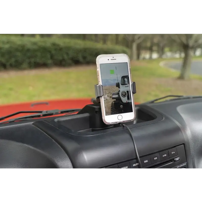 Car phone holder attached to dashboard in Rugged Ridge Dash Multi-Mount Charging Phone Kit 11-18 JK