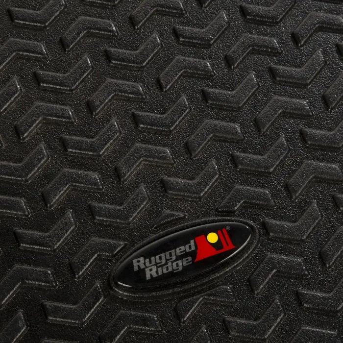 Rugged Ridge floor liner with red dot logo on rubber surface