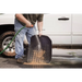 Man cleaning tire with Rugged Ridge floor liner for Jeep Wrangler.