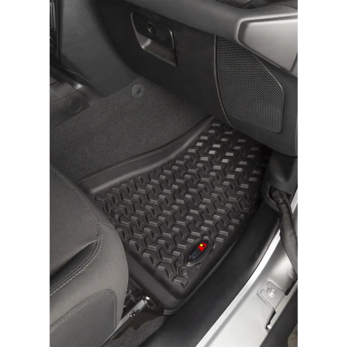 Rugged Ridge floor mat with red button for Jeep Wrangler and Gladiator