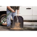 Man cleaning tire with Rugged Ridge Floor Liner for Jeep Wrangler.
