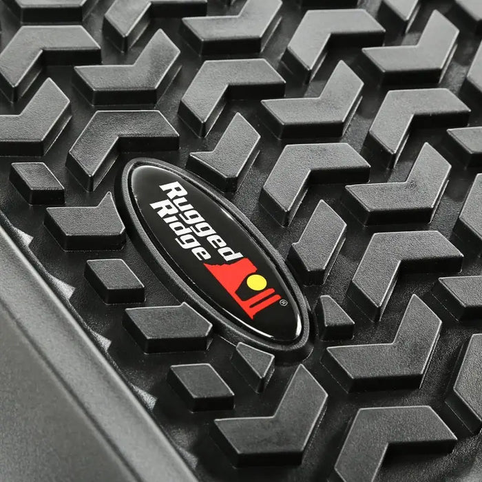 Rugged Ridge Floor Liner on Black Jeep Wrangler JK - Front Logo View