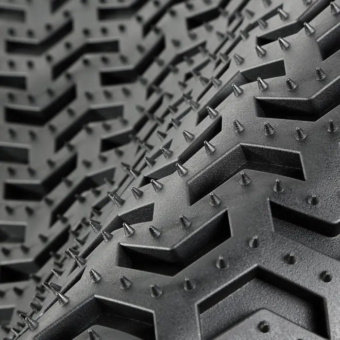 Rugged Ridge floor liner displaying tread of bicycle tire.