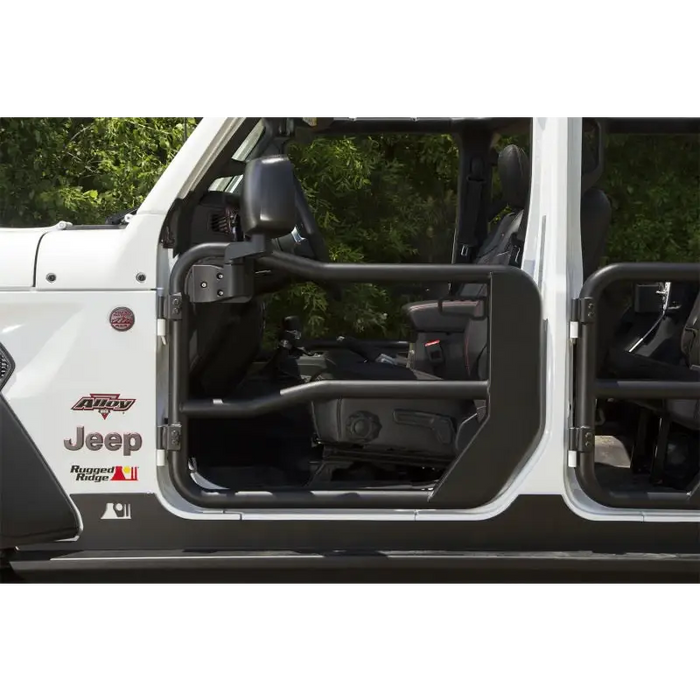 Rugged Ridge front tube doors on white Jeep Wrangler with open door.
