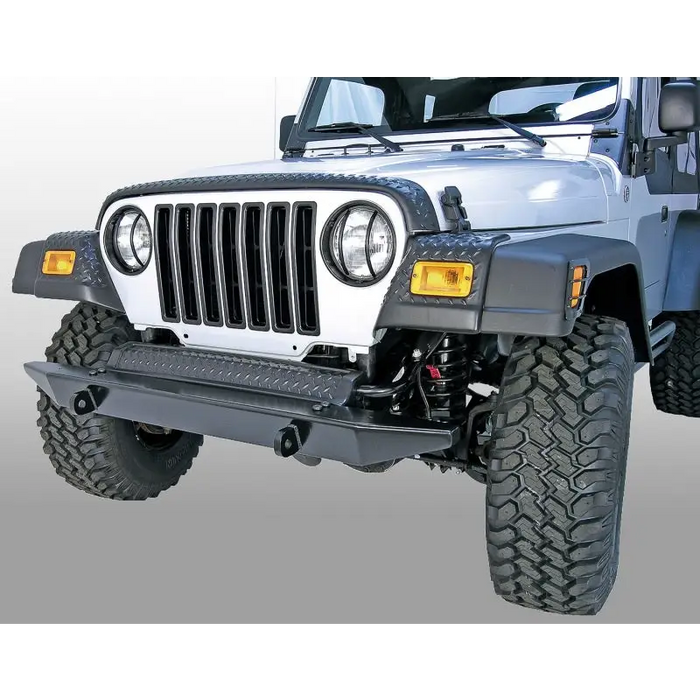 Close-up of jeep with bumper-mounted rugged ridge Front Fender Guards Body Armor for 97-06 Jeep Wrangler