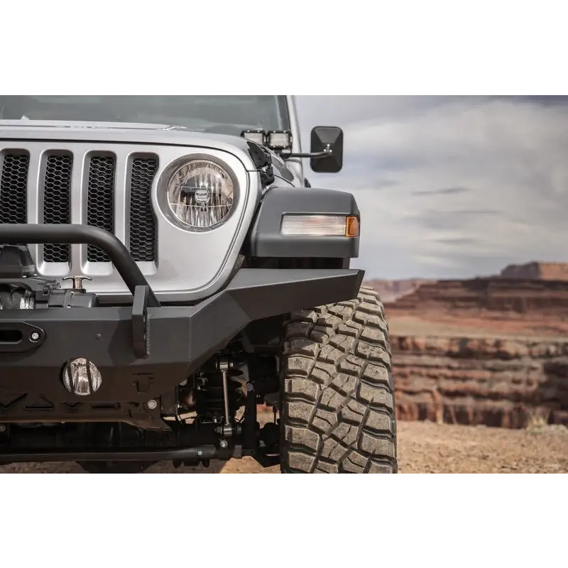 Rugged Ridge HD Bumper on Jeep Wrangler with Big Tire in Dirt Road