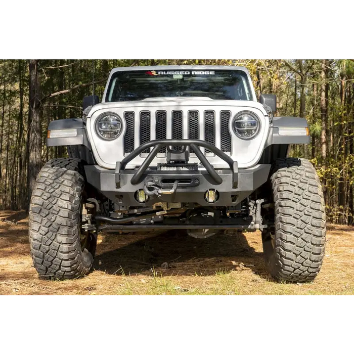 Close up of Rugged Ridge Jeep Wrangler HD Bumper Stubby Front tire on dirt road