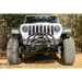 Close up of Rugged Ridge Jeep Wrangler HD Bumper Stubby Front tire on dirt road