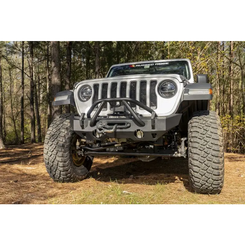 Closeup of Rugged Ridge HD Bumper on Jeep Wrangler with big tire on dirt road