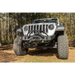 Closeup of Rugged Ridge HD Bumper on Jeep Wrangler with big tire on dirt road