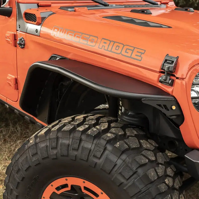 Rugged Ridge HD Steel Tube Fenders Front Pair Black 18-19 JL featuring a jeep with large tire