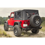 Rugged Ridge Hurricane Fender Flare Kit on Jeep Wrangler parked on dirt road
