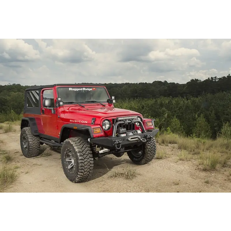 Jeep Wrangler on rugged dirt road, Hurricane flat fender flares.