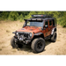 Jeep Wrangler with Rugged Ridge Hurricane Flat Fender Flare Kit parked in dirt