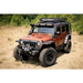 Jeep Wrangler parked in dirt with Rugged Ridge Hurricane Flat Fender Flare Kit