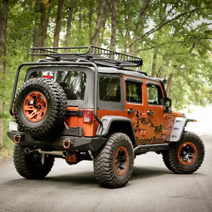 Flat fender kit for Jeep Wrangler with orange wheels and tires.