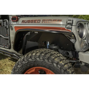 Front bumper mounted on Rugged Ridge aluminum fender liners for Jeep Wrangler JL.