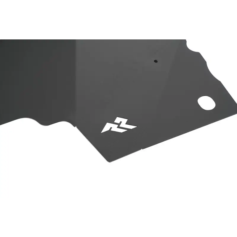 Close-up of black metal plate with white arrow on Rugged Ridge aluminum fender liners for Jeep Wrangler JL.