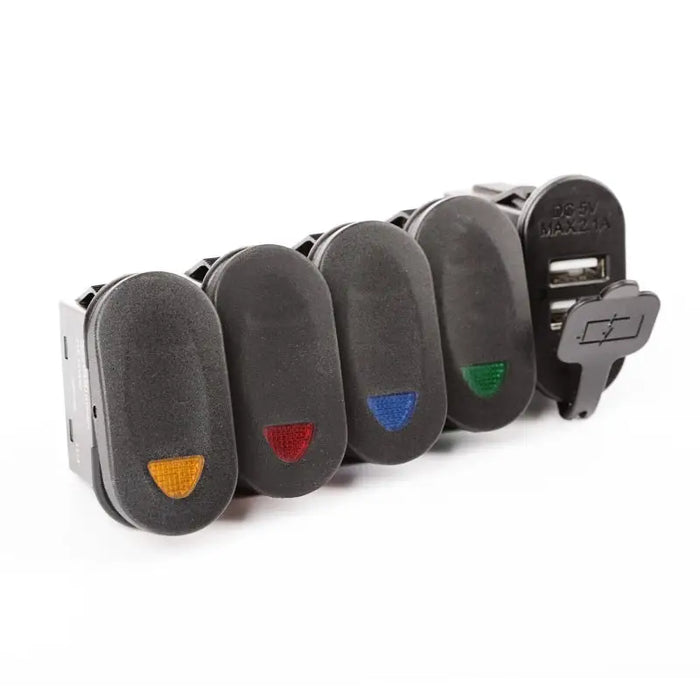 Black leather guitar strap with colorful patch displayed on Rugged Ridge Lower Switch Panel Kit for Jeep Wrangler JK/JKU.