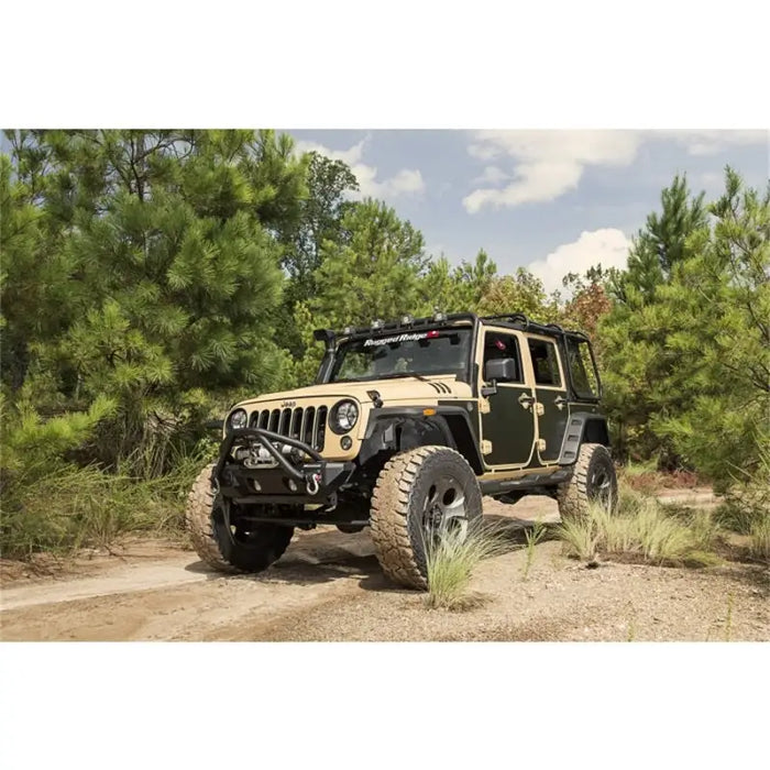 Magnetic protection panel kit for Jeep Wrangler parked in dirt.