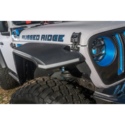 Rugged Ridge Max Terrain fender flare set on blue and white decal Jeep Wrangler.