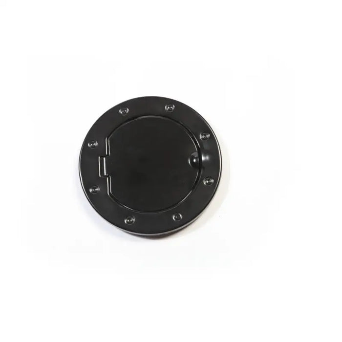 Black plastic gas cap knob on white background.