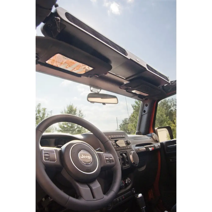 Rugged Ridge Overhead Storage Console for Jeep Wrangler with steering and dashboard.