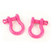 Two pink horseshoe d-ring shackles by Rugged Ridge on white background