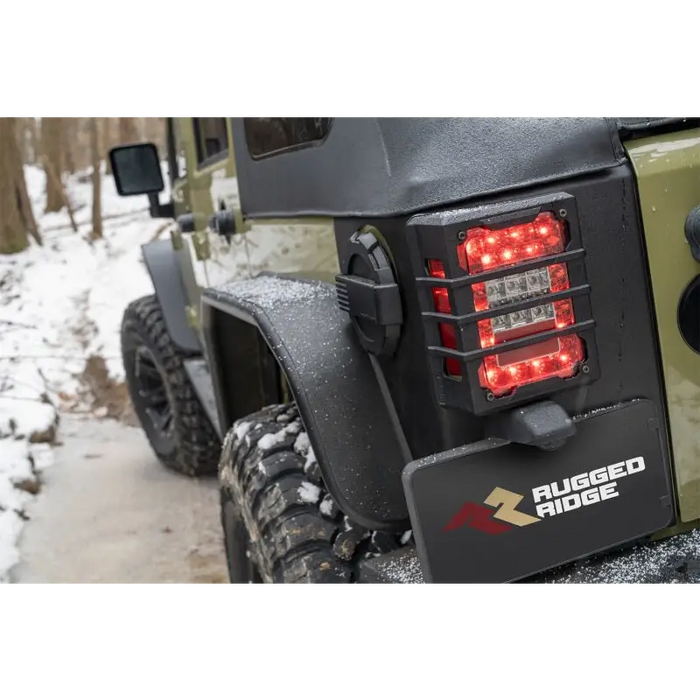 Close up of a red light on rugged ridge rear corner kit body armor for 07-18 jeep wrangler jku