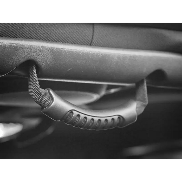 Close up of steering wheel on Jeep Wrangler with grab handles