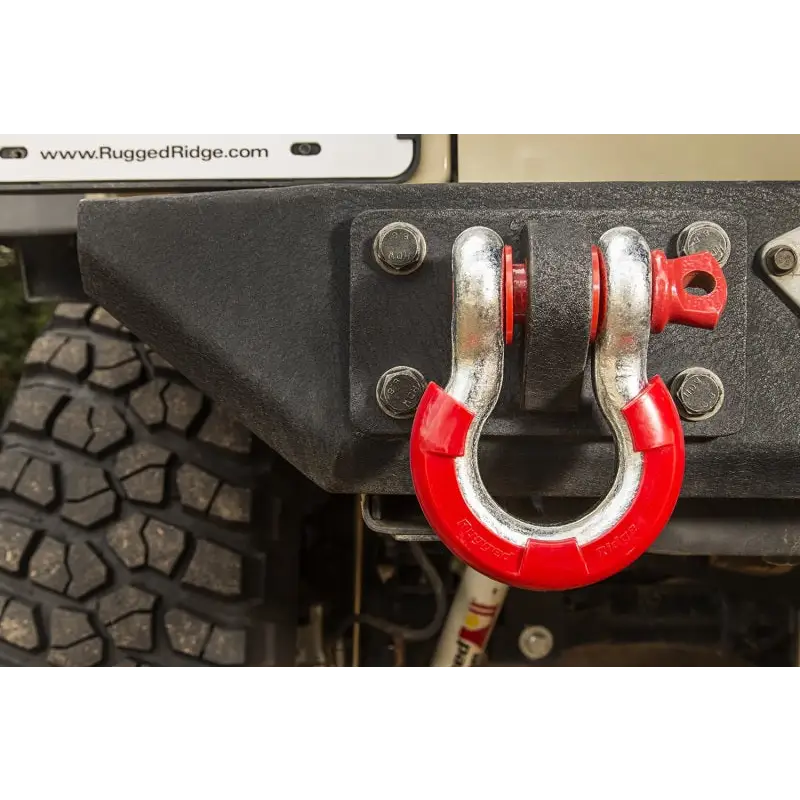 Rugged Ridge Red D-Ring Isolator Kit on front of vehicle