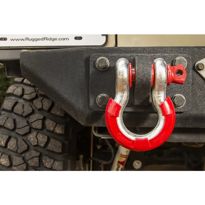 Rugged Ridge Red D-Ring Isolator Kit on front of vehicle