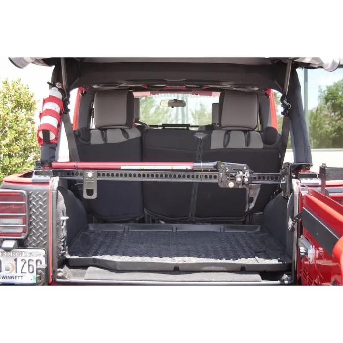 Rugged Ridge roll bar mounting bracket for Wrangler - rear view of red truck