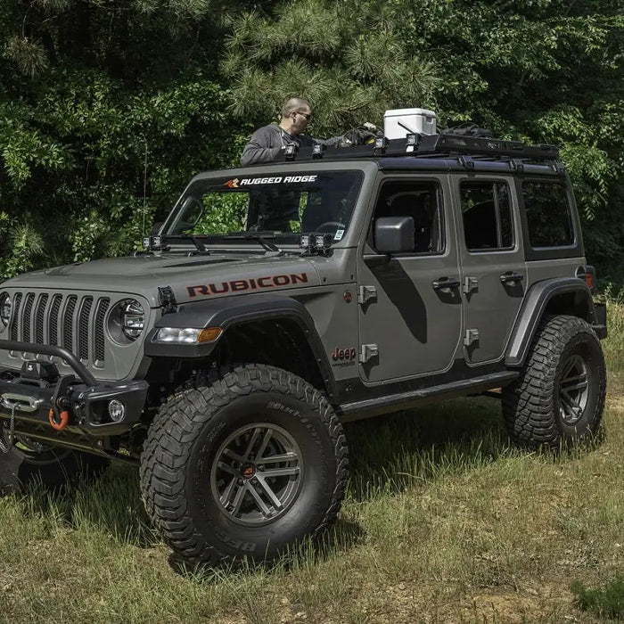 Jeep parked in field with Rugged Ridge roof rack on Jeep Wrangler JL.