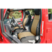 Front seats of a red truck with Rugged Ridge seat cover from Jeep Wrangler JK.