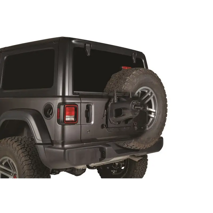Rugged Ridge Spare Tire Relocation Bracket for Jeep Wrangler JL - Close up of tire on white background.
