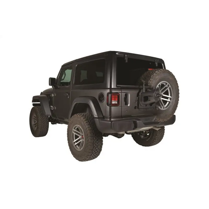 Black top Arafed Jeep displaying Rugged Ridge Spare Tire Relocation Bracket for Jeep Wrangler JL.