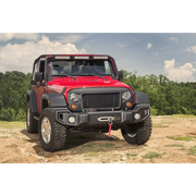 Rugged Ridge Spartacus Front Bumper Black on Jeep Wrangler parked on dirt road