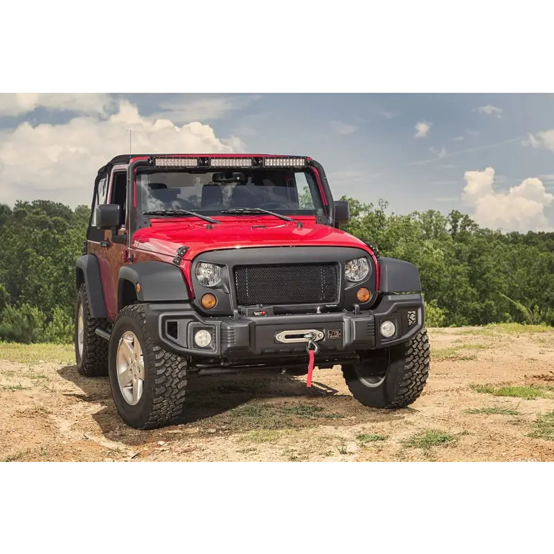 Rugged Ridge Spartacus Front Bumper Black on Jeep Wrangler parked on dirt road